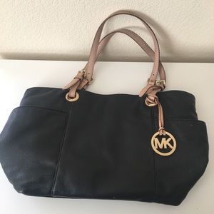 Black Michael Kors bag.